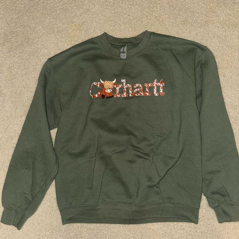 Green sweatshirt with cow